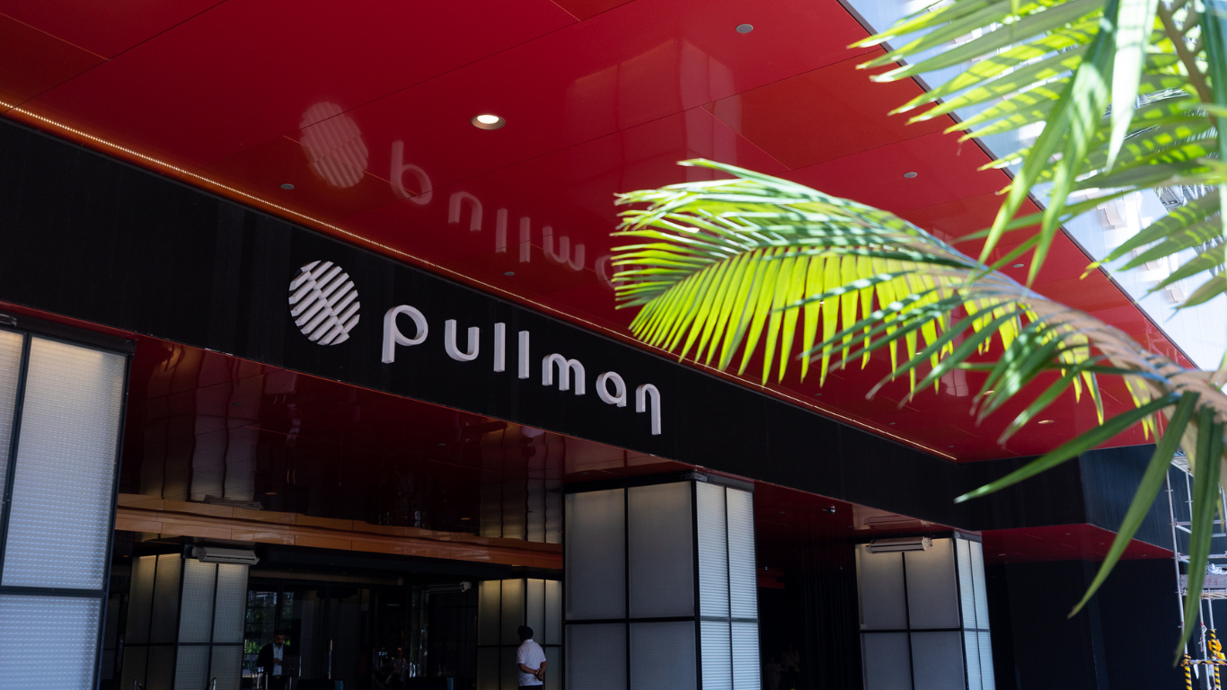 Front door of The Park Lane Hong Kong, a Pullman Hotel - Signage of Pullman